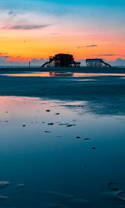 Preview wallpaper sea, coast, sunset, water, sky, puddle