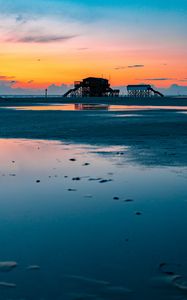 Preview wallpaper sea, coast, sunset, water, sky, puddle