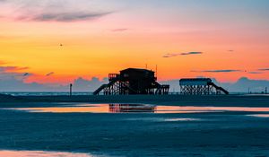 Preview wallpaper sea, coast, sunset, water, sky, puddle