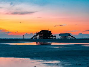 Preview wallpaper sea, coast, sunset, water, sky, puddle