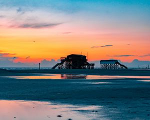 Preview wallpaper sea, coast, sunset, water, sky, puddle