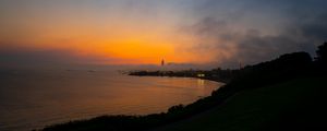 Preview wallpaper sea, coast, tower, clouds, evening, sky