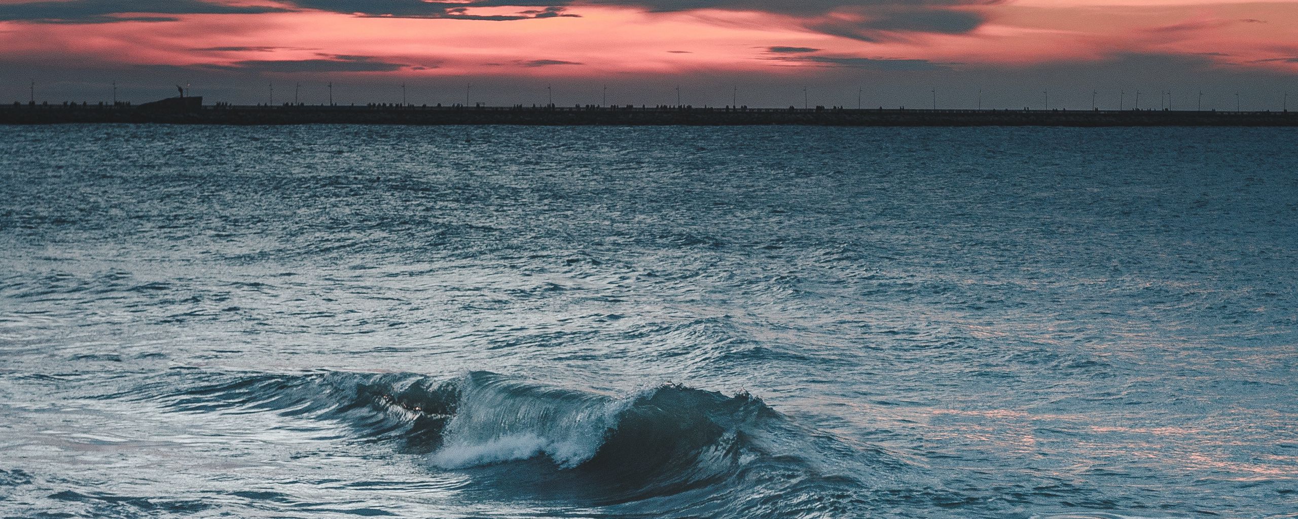 Download wallpaper 2560x1024 sea, coast, wave, surf, twilight, horizon