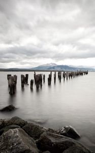 Preview wallpaper sea, distance, mountains, pillars