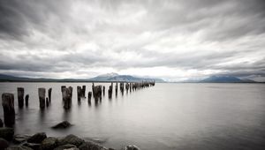 Preview wallpaper sea, distance, mountains, pillars