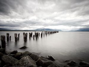 Preview wallpaper sea, distance, mountains, pillars