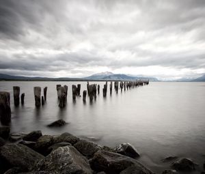 Preview wallpaper sea, distance, mountains, pillars