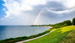 Preview wallpaper sea, embankment, rainbow, city, nature