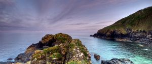 Preview wallpaper sea, evening, stones, rocks, grass