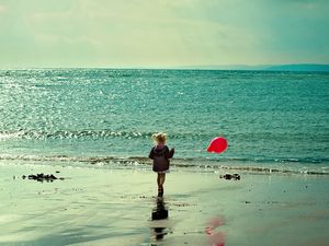 Preview wallpaper sea, girl, walking, beach, run, balloon