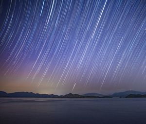 Preview wallpaper sea, hills, starry sky, freezelight, night