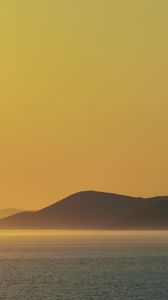 Preview wallpaper sea, hills, sunrise, landscape, nature