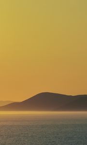 Preview wallpaper sea, hills, sunrise, landscape, nature