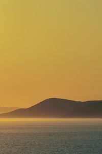 Preview wallpaper sea, hills, sunrise, landscape, nature