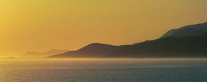 Preview wallpaper sea, hills, sunrise, landscape, nature