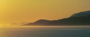 Preview wallpaper sea, hills, sunrise, landscape, nature