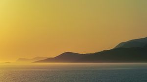 Preview wallpaper sea, hills, sunrise, landscape, nature