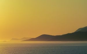 Preview wallpaper sea, hills, sunrise, landscape, nature