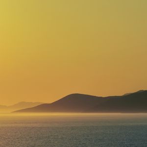 Preview wallpaper sea, hills, sunrise, landscape, nature