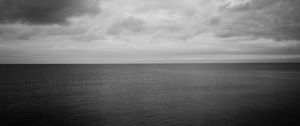 Preview wallpaper sea, horizon, bw, sky, clouds