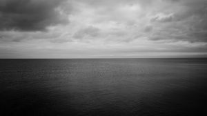 Preview wallpaper sea, horizon, bw, sky, clouds