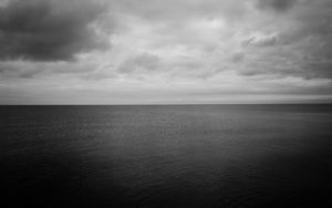 Preview wallpaper sea, horizon, bw, sky, clouds