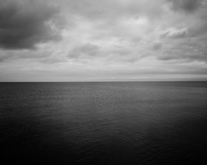 Preview wallpaper sea, horizon, bw, sky, clouds