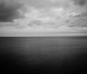 Preview wallpaper sea, horizon, bw, sky, clouds