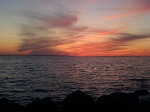 Preview wallpaper sea, horizon, evening, stones, dark, nature