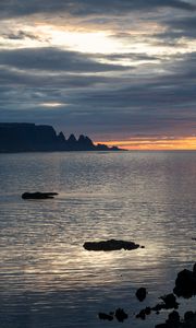 Preview wallpaper sea, horizon, glare, ripples, rocks, clouds, nature