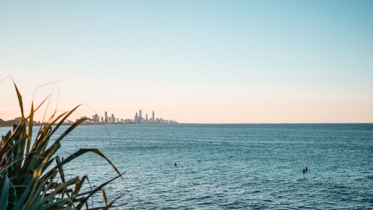 Wallpaper sea, horizon, grass, stones, city