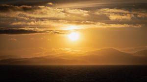 Preview wallpaper sea, horizon, hills, clouds, twilight
