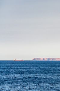 Preview wallpaper sea, horizon, rocks, ship