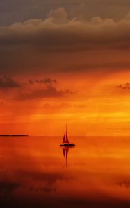 Preview wallpaper sea, horizon, sail, sunset, lonely, clouds