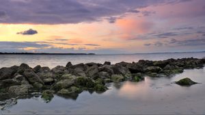 Preview wallpaper sea, horizon, stones, landscape, twilight
