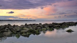 Preview wallpaper sea, horizon, stones, landscape, twilight