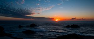 Preview wallpaper sea, horizon, sun, sunset, clouds, landscape, dark