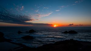 Preview wallpaper sea, horizon, sun, sunset, clouds, landscape, dark