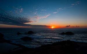 Preview wallpaper sea, horizon, sun, sunset, clouds, landscape, dark