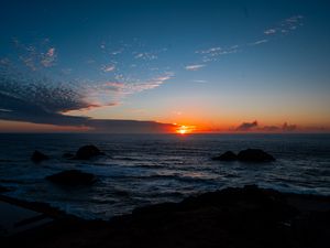 Preview wallpaper sea, horizon, sun, sunset, clouds, landscape, dark