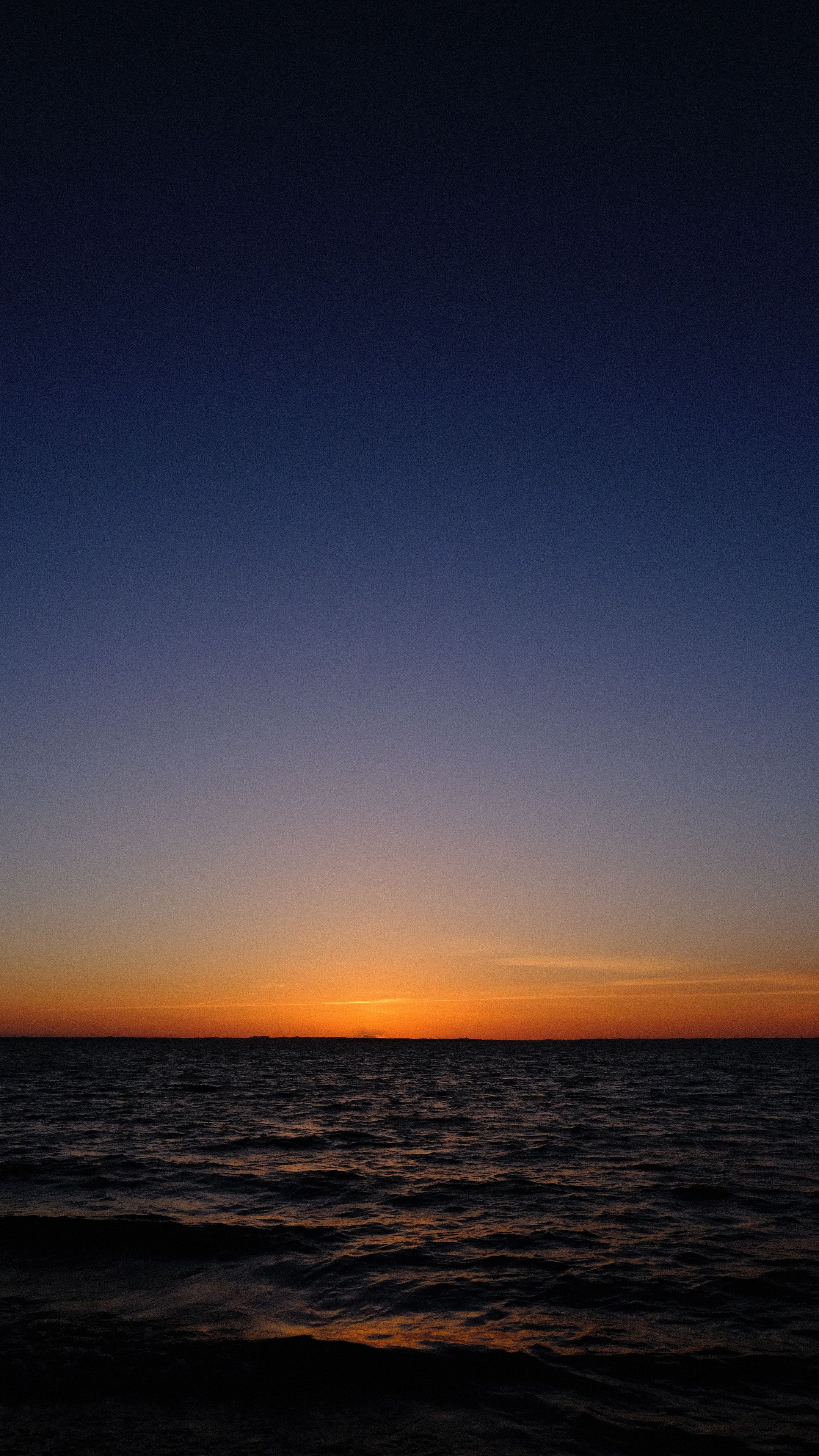 Download wallpaper 2160x3840 sea, horizon, sunset, sky, dark, night