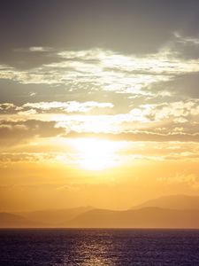 Preview wallpaper sea, horizon, sunset, clouds, mountains, fog