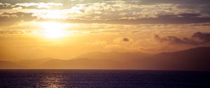 Preview wallpaper sea, horizon, sunset, clouds, mountains, fog