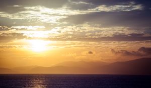 Preview wallpaper sea, horizon, sunset, clouds, mountains, fog