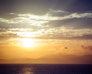 Preview wallpaper sea, horizon, sunset, clouds, mountains, fog