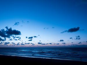 Preview wallpaper sea, horizon, sunset, clouds, twilight, shore
