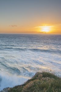 Preview wallpaper sea, horizon, waves, sunset, shore, grass