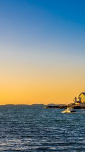 Preview wallpaper sea, houses, sky, sunset
