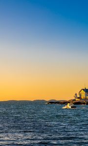 Preview wallpaper sea, houses, sky, sunset