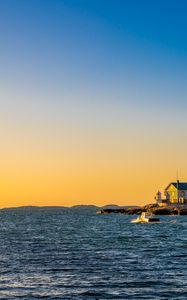 Preview wallpaper sea, houses, sky, sunset
